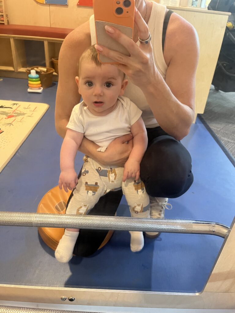 baby in play mirror at the library