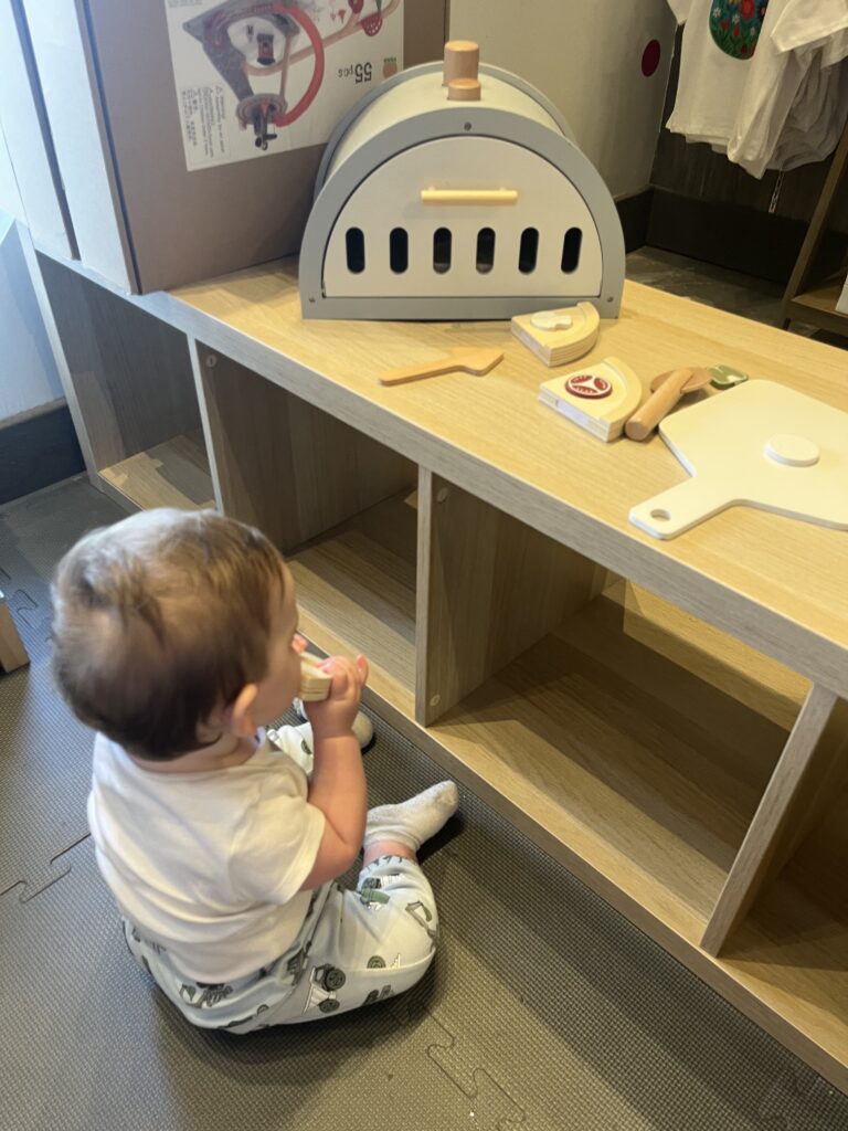 baby nook baby playing with pizza oven toy