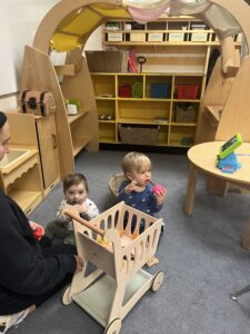 strongstart renfrew baby boys playing with shopping cart