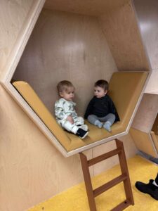 babies in britannia library reading nook