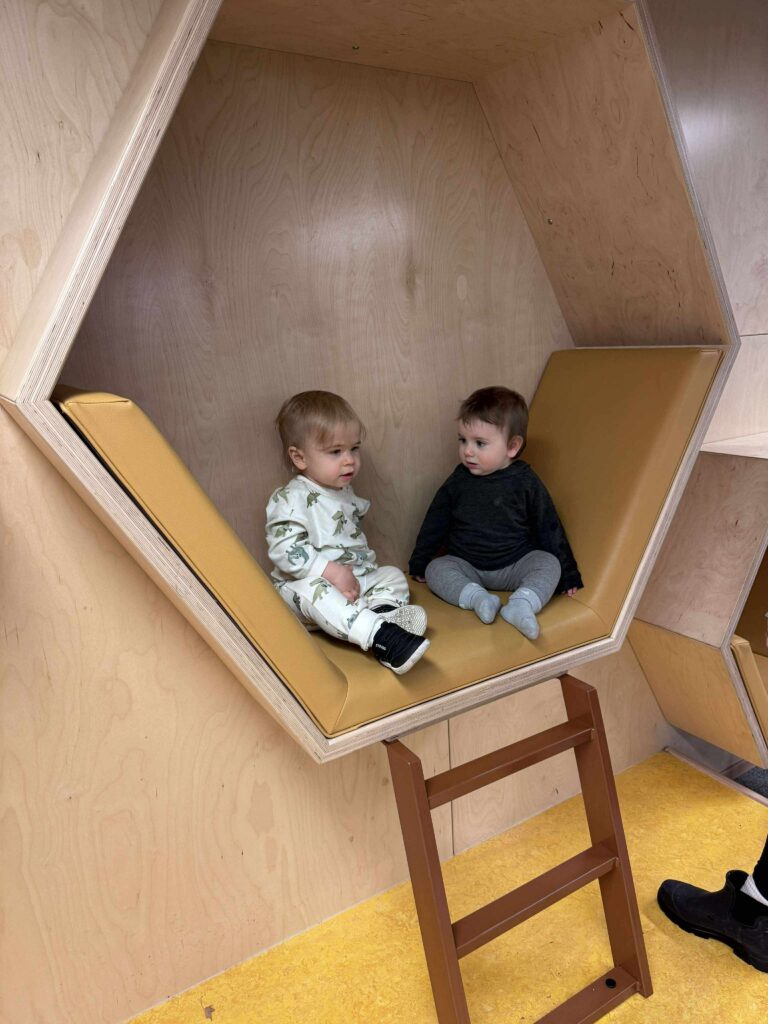 babies in britannia library reading nook